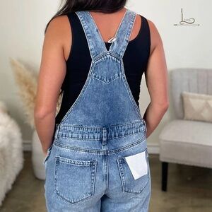 Distressed denim overalls-Brand new. Never worn.
